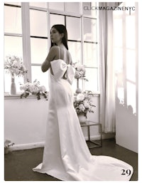 a black and white photo of a woman in a wedding dress