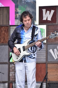 a man playing a guitar