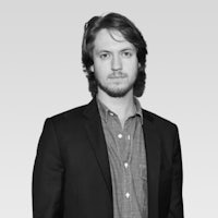 a black and white photo of a man in a suit
