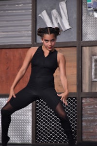 a woman in a black bodysuit